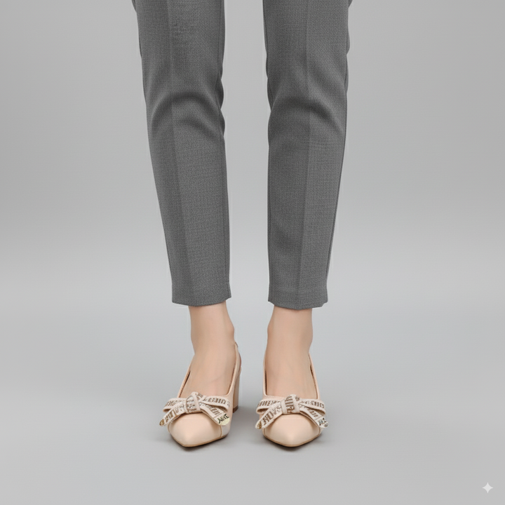 Gray pants worn with beige shoes on a gray background