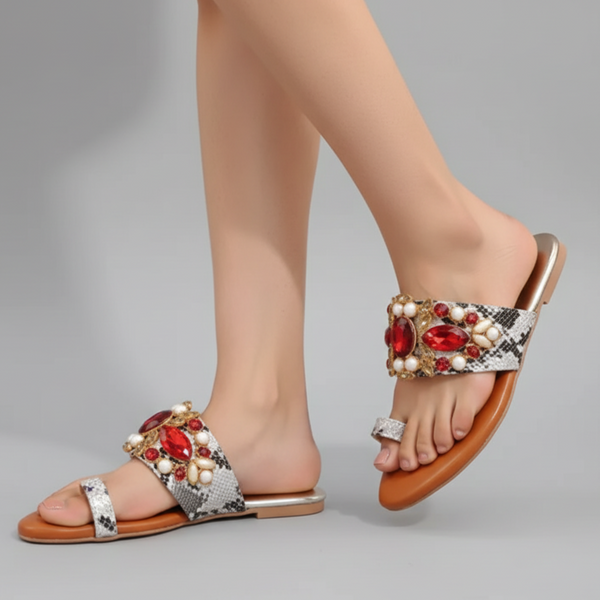 Decorative sandals with gemstones on a gray background