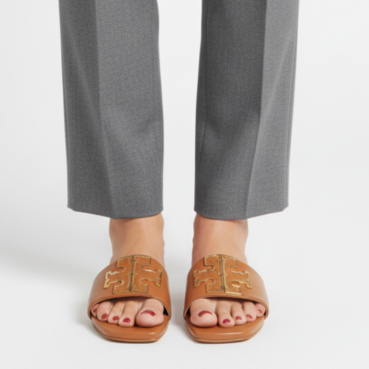 Gray pants worn by a person on a white background