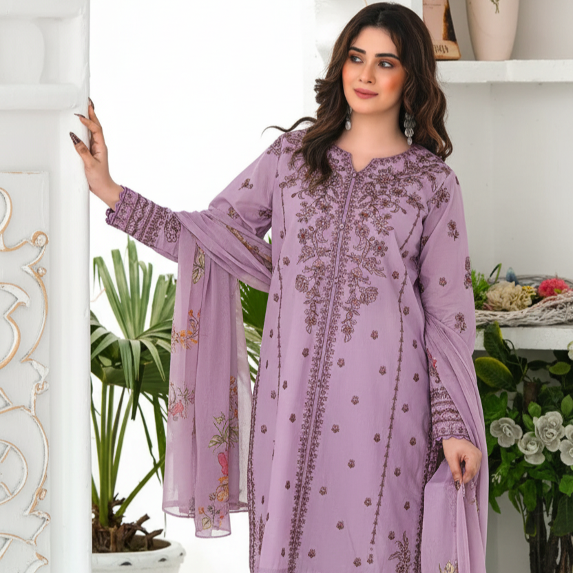 Woman wearing a purple embroidered outfit with a floral background