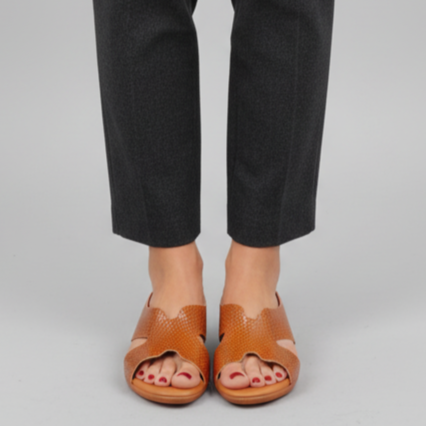 Person wearing gray pants on a gray background