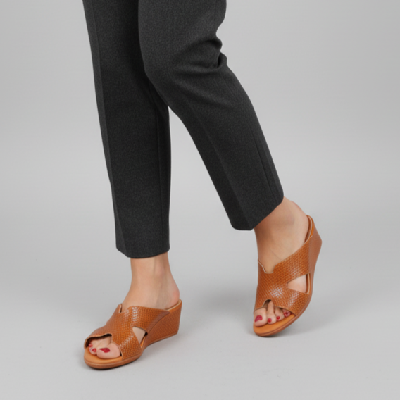 Person wearing dark gray pants on a gray background