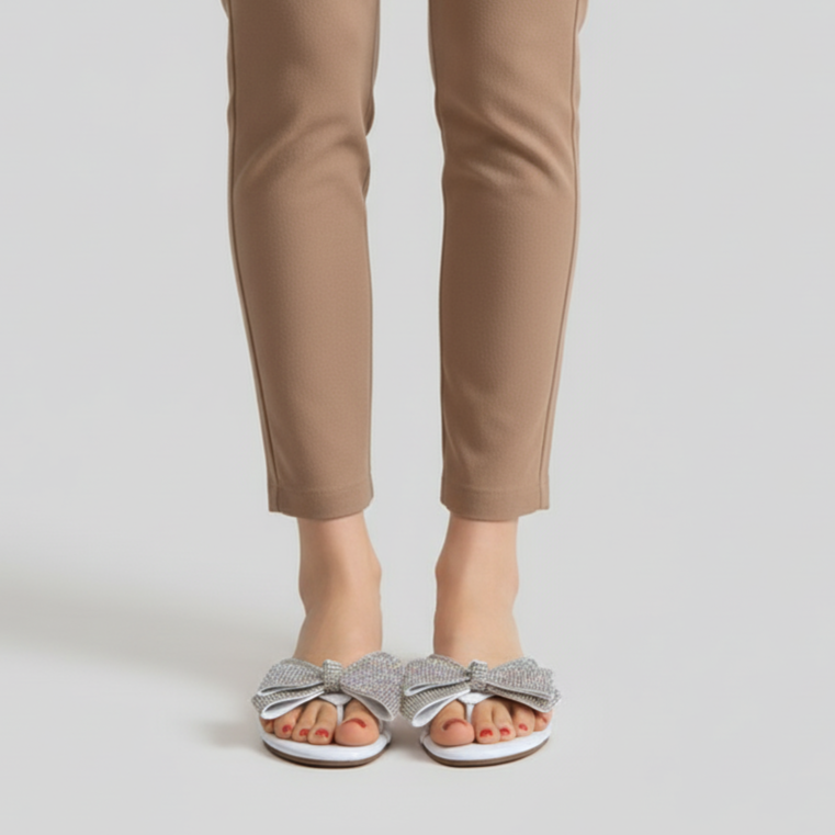 Beige pants worn by a person on a plain background